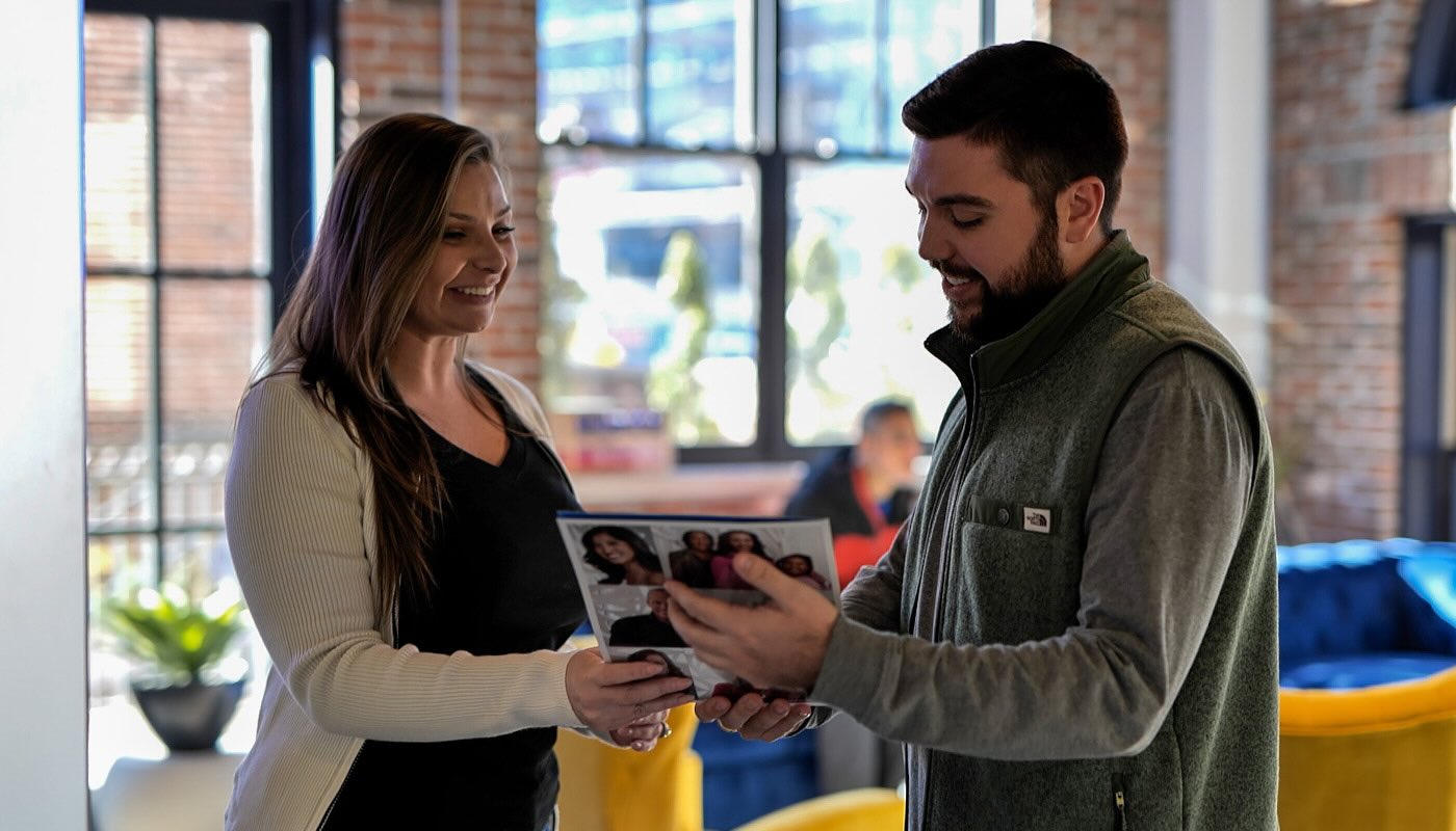 Atlanta Dental Spa team member discussing financing options with a patient in a welcoming office environment.